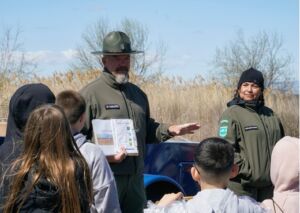 Washington State Parks Interpretive Rangers leading a station on the local watershed