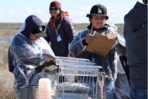 Columbia Basin Conservation District Soil Scientists lead students in rainfall simulator and run off tests
