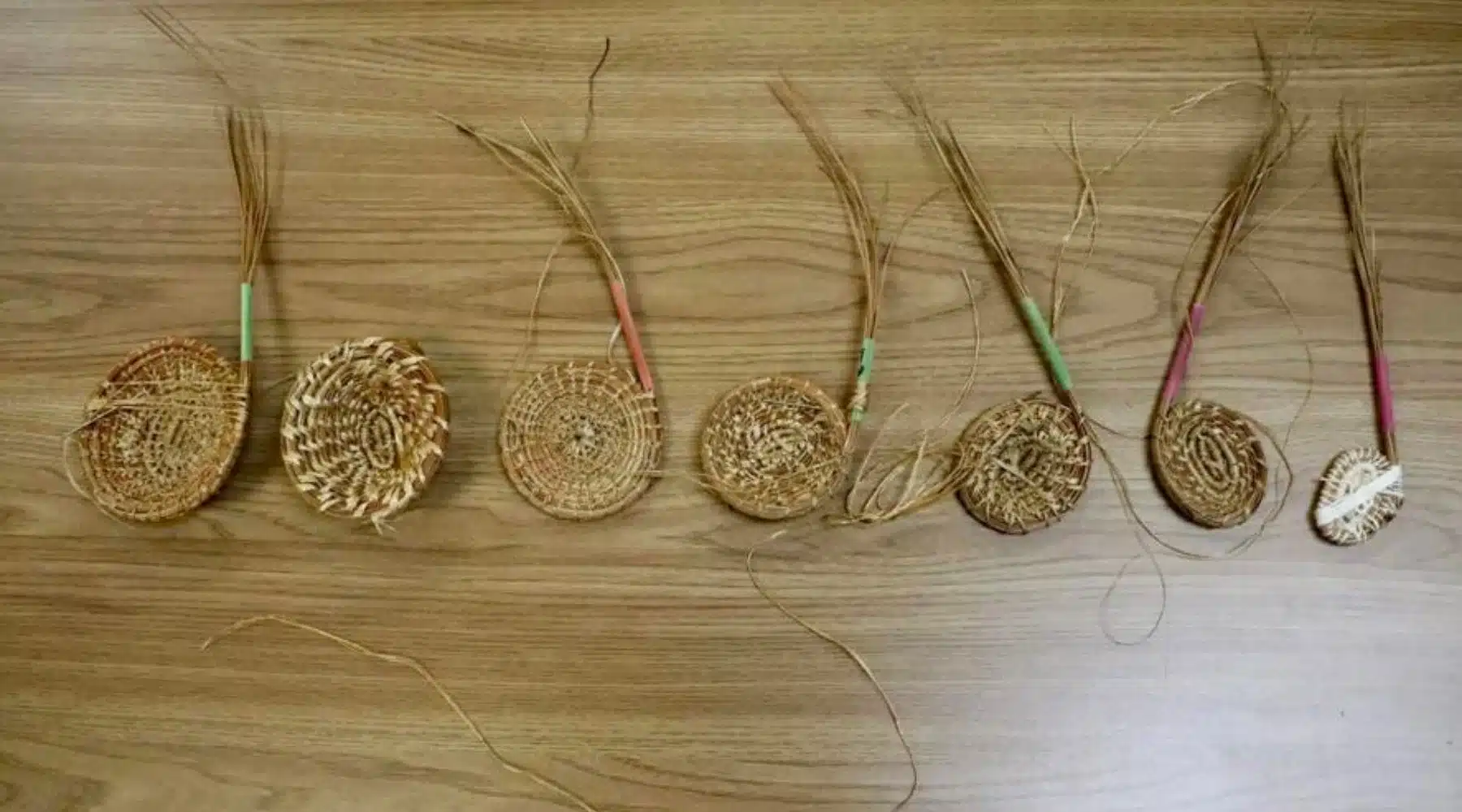 Close-up of seven handmade baskets from the Natural Resources class.
